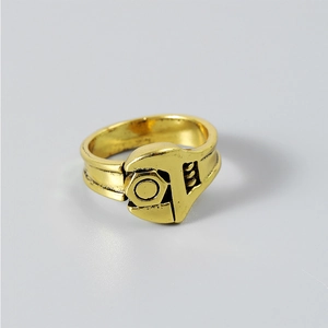 Macro detail of industrial wrench and nut ring in vintage gold finish for men