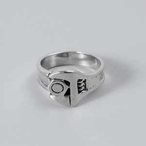 Macro shot of silver metal wrench and hex nut ring with detailed mechanical texture
