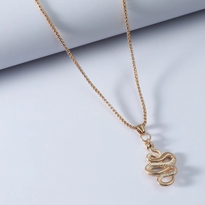 Golden 3D snake pendant necklace with textured scales on minimalist white background