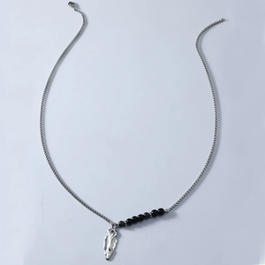 Men's silver beaded chain necklace with triangular spearhead pendant on a gray background