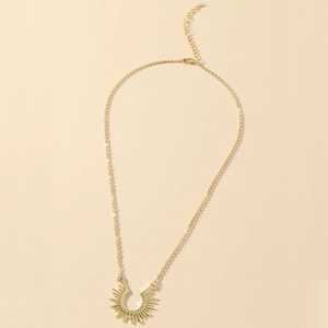 Detailed view of golden stainless steel sunburst pendant with a fine O-chain and clasp
