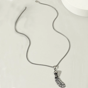 Retro punk skull and feather pendant necklace with vintage silver finish on box chain