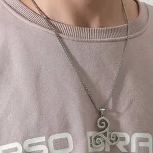 Mens silver Triskele pendant necklace featuring a Celtic triple spiral design on metal chain
