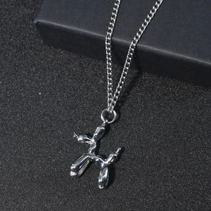 Polished silver stainless steel balloon dog pendant necklace with a minimalist chain