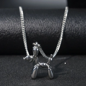 Polished silver balloon dog pendant necklace in stainless steel with a mirror finish