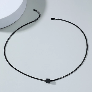 Detail of minimalist black cube pendant with adjustable chain and lobster clasp