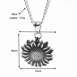 Detailed close-up of a vintage sunflower pendant with aged silver finish and 60cm chain