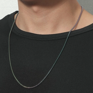 Rainbow box chain necklace in titanium steel worn on a black shirt for a hip-hop look