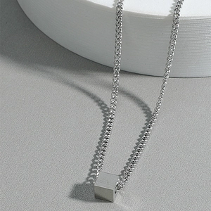 Minimalist industrial style stainless steel cube pendant necklace with brushed metal finish
