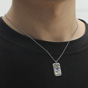 Vintage tarot lovers necklace with silver pendant and purple heart on black t-shirt