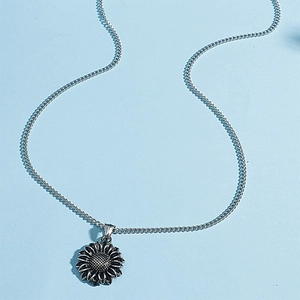 Retro vintage sunflower pendant necklace in antique silver with textured grid details