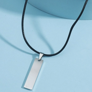 Minimalist silver rectangular stainless steel bar pendant on black cord necklace