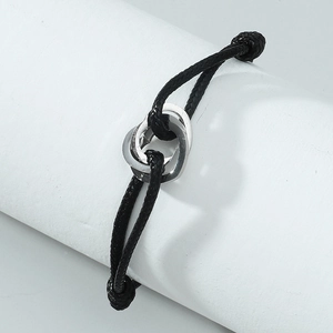 Adjustable black woven rope bracelet with intertwined silver metal rings for couples