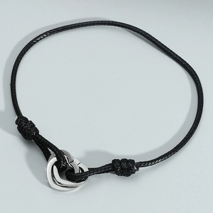 Minimalist black braided cord bracelet with silver interlocking double hearts pendant