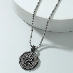 Cyberpunk steampunk gear pendant necklace in antique silver with box chain on white stone