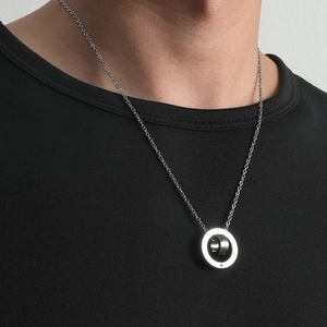 Men's double ring necklace with nested circular pendants on a silver chain