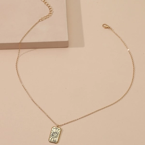 Vintage gold tarot world pendant necklace for women with elegant chain on beige background