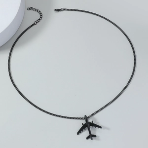 Detail of matte black airplane pendant necklace with adjustable chain and lobster clasp