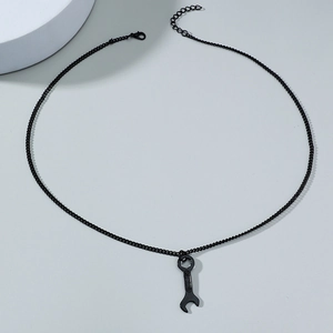 Detail of matte black wrench pendant necklace with adjustable chain and lobster clasp