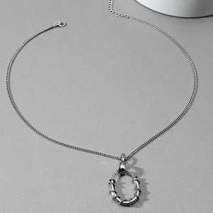 Retro punk titanium steel necklace with thorn-wrapped oval circle pendant for men