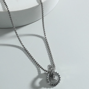 Industrial gear pendant necklace in stainless steel with interlocking double cogwheels design