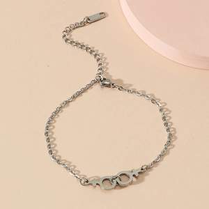 Polished stainless steel bracelet featuring interlocking Venus symbols with lobster clasp
