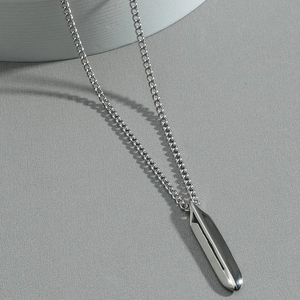 Minimalist silver geometric pendant necklace with polished cylinder on fine chain
