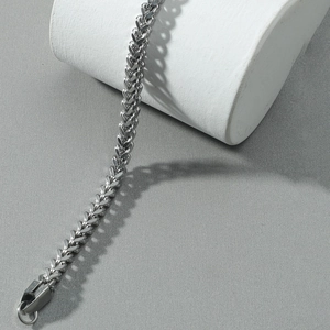 Polished silver stainless steel spiga wheat chain bracelet with secure lobster clasp