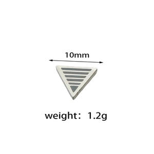Detailed view of triangular stainless steel earring with horizontal stripe texture