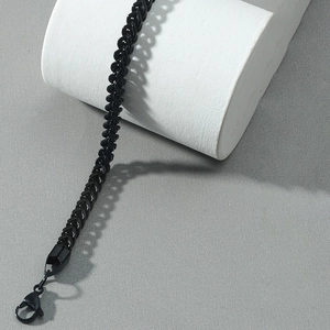 Detail of black Franco chain bracelet with lobster clasp on white display stand