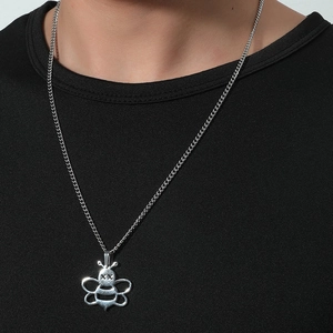 Minimalist silver bee pendant necklace with cross-eye design on a stainless steel chain