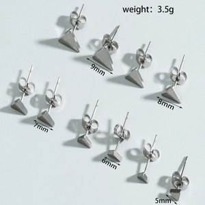 Detail view of triangular stainless steel stud earrings in five different sizes 5mm to 9mm
