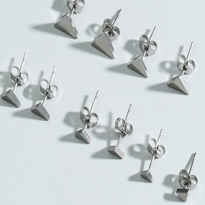 Five pairs of minimalist geometric triangle stud earrings in polished stainless steel