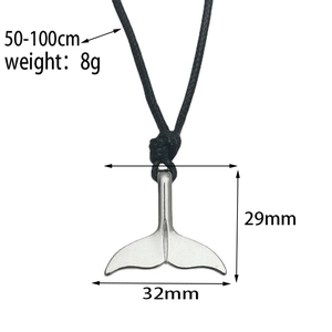 Macro shot of silver fishtail pendant measuring 32x29mm with adjustable cord