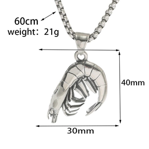 Detail of vintage silver shrimp pendant with clear textures on a 60cm box chain