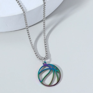 Macro shot of stainless steel hollow basketball pendant with iridescent gradient finish