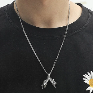 Retro punk dragon claw necklace for men with vintage matte silver pendant on black T-shirt