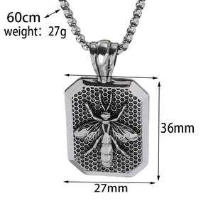 Macro detail of retro silver bee tag pendant featuring honeycomb grid texture and dimensions