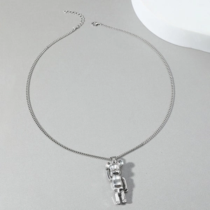 Minimalist hip hop style bear pendant with polished silver finish on long sweater chain