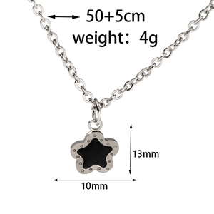 Detailed view of silver star pendant with black enamel center and size specifications