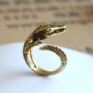 Retro crocodile open ring in antique gold finish with detailed scale texture