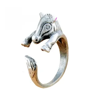 Macro detail of retro silver adjustable horse ring with vintage brushed texture