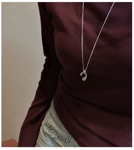 Long S925 sterling silver water drop necklace pendant on dark red sweater
