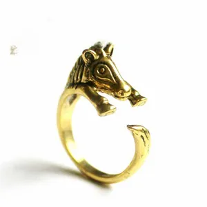 Macro detail of vintage gold crocodile open ring with intricate animal head carving