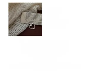 Detail of S925 sterling silver hollow heart pendant with 65cm long sweater chain