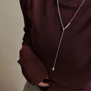 Minimalist 925 sterling silver Y-shaped long necklace with polished beads on sweater
