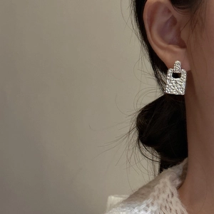 Minimalist S925 sterling silver geometric earrings with a hammered texture and cutout design
