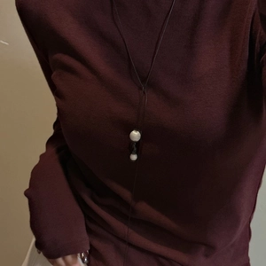 Minimalist S925 sterling silver long necklace with brushed double sphere pendants on a model