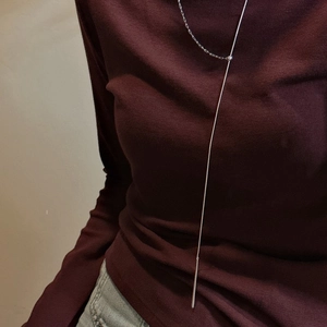 S925 sterling silver long Y-shaped necklace with teardrop pendant on red sweater