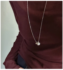Close-up of S925 sterling silver necklace featuring frosted and polished double ball beads